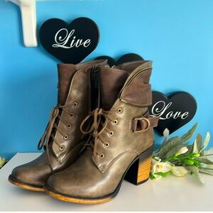 Pierre Dumas faux lace up heeled boots with side zipper closure. Size 7 1/2.